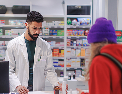 Pharmacist assisting patient